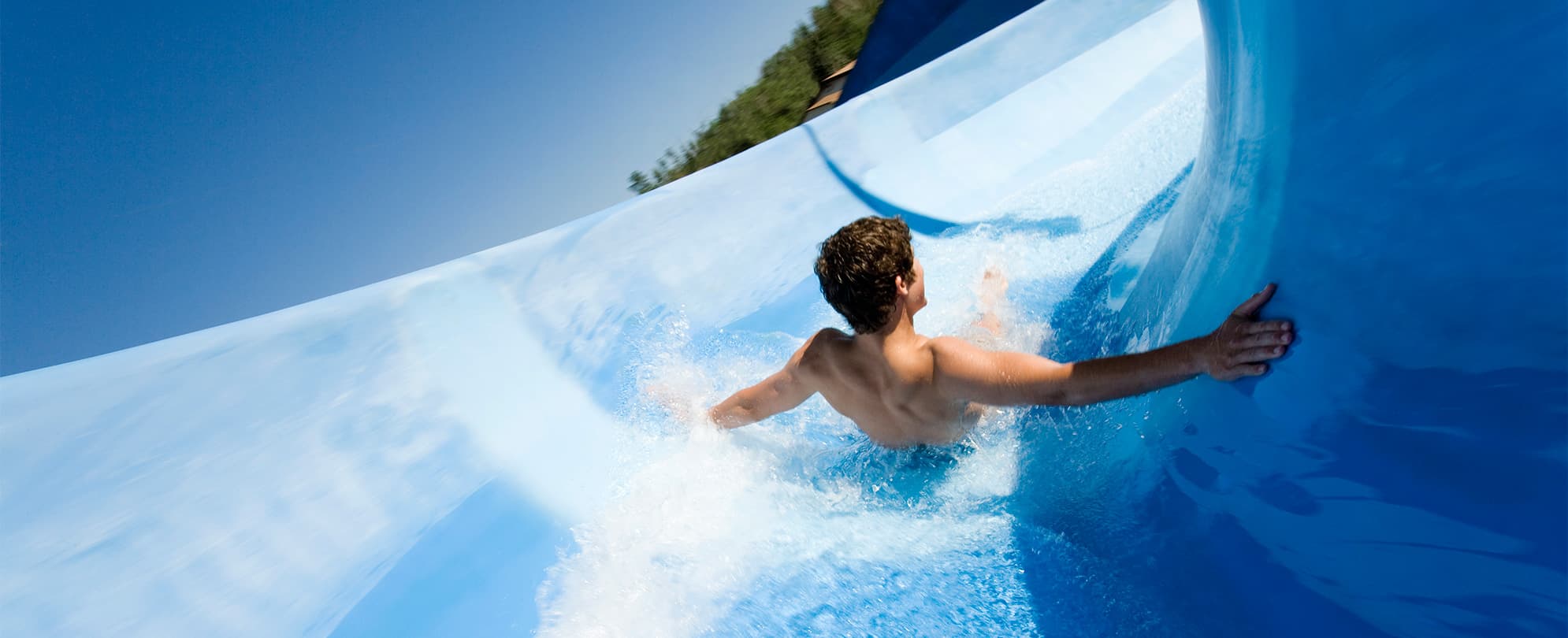 A boy on a water park slide at Silver Dollar City in Branson, Missouri.