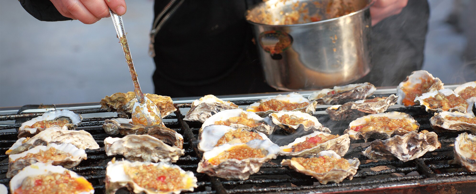 Oysters Rockefeller being prepared by a chef at Antoine's Restaurant in New Orleans. 