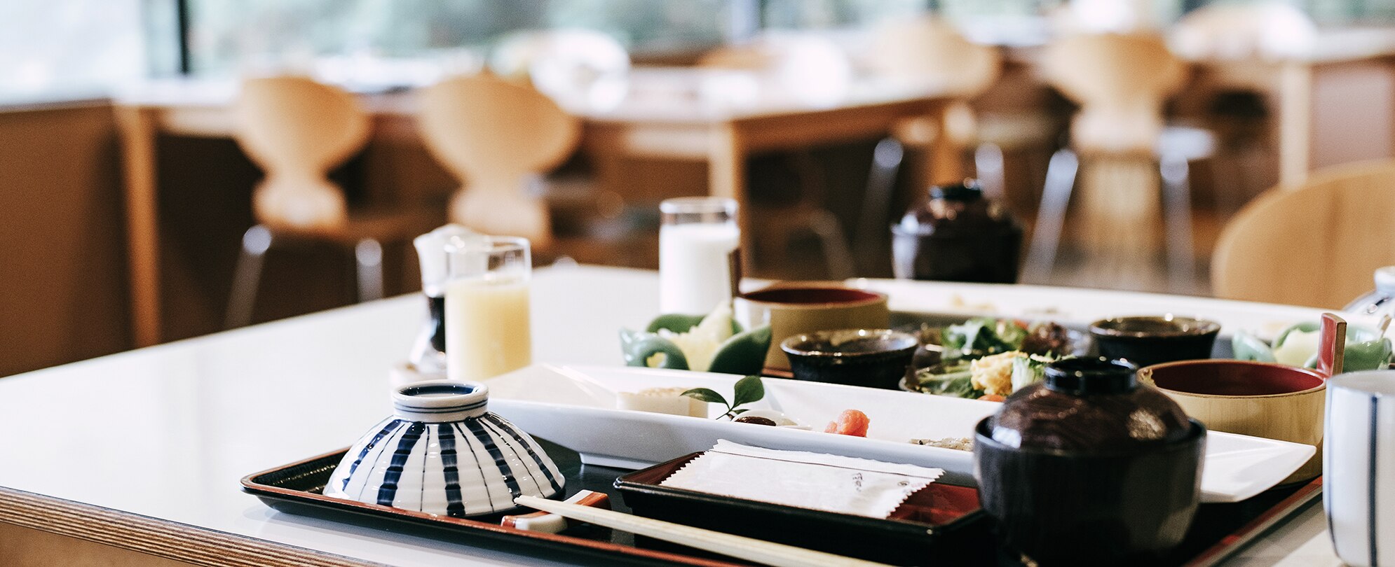 A dinnerware set of salads and drinks on a table at a Park Ave restaurant in Winter Park, Florida.