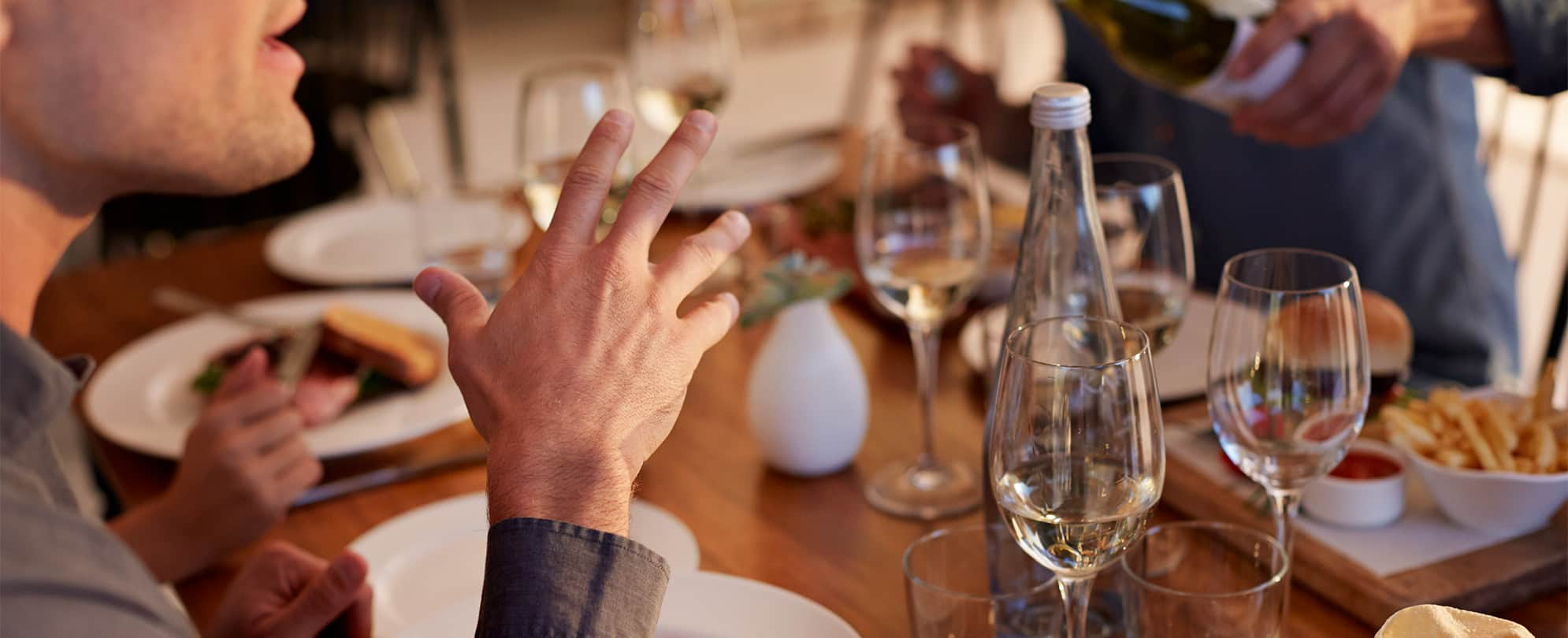 Friends enjoy food and wine on a food tour in Park City, Utah.