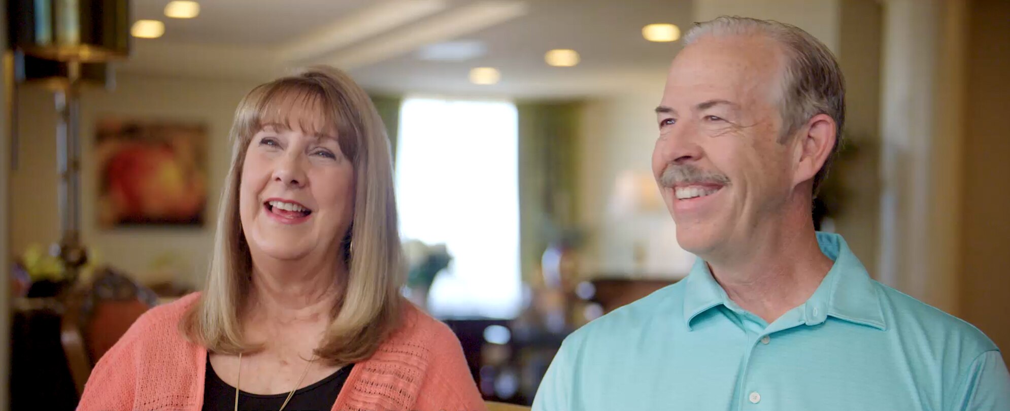 Two Club Wyndham owners standing next to each other excited to learn about the New Owner Quick Start in the Club Wyndham Owner Guide. 